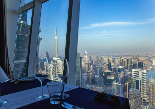 View of Dubai skyline from a high-rise apartment, highlighting the city's modern architecture and luxury living.