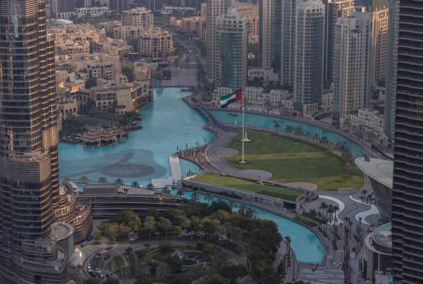 Aerial view of luxury apartments and iconic waterfront in Downtown Dubai, highlighting prime real estate areas.