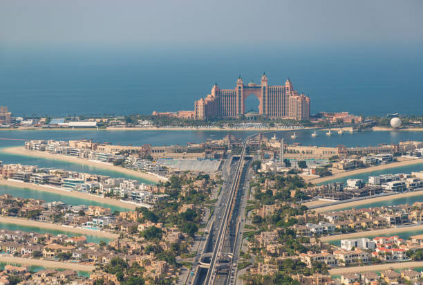 Aerial view of Dubai's Palm Jumeirah with luxury apartments illustrating assignment property practices.